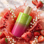 MELITE PARFUMS Intoxicating Femininity 55ml EDP bottle surrounded by fresh strawberries, watermelon, and lily of the valley