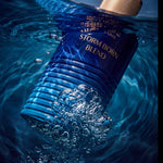 MELITE PARFUMS Storm Born Blend men's EDP bottle submerged in dark blue water with bubbles and golden cap