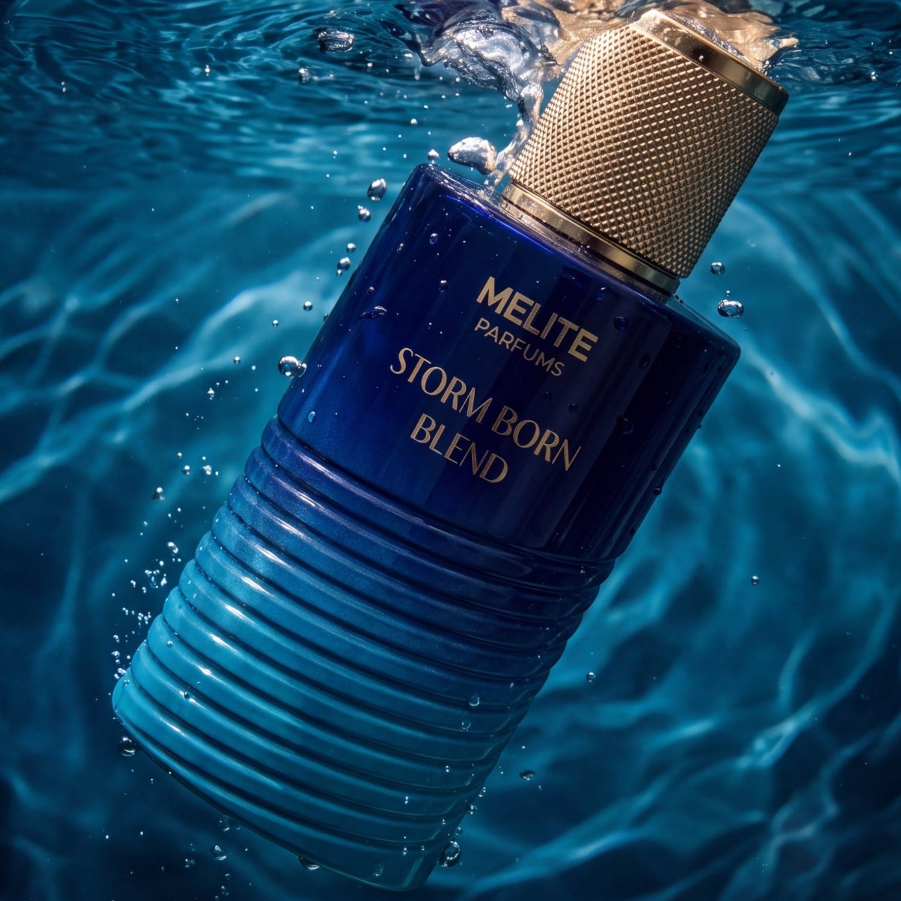 MELITE PARFUMS Storm Born Blend men's EDP in a blue glass bottle submerged in water with bubbles and a gold cap