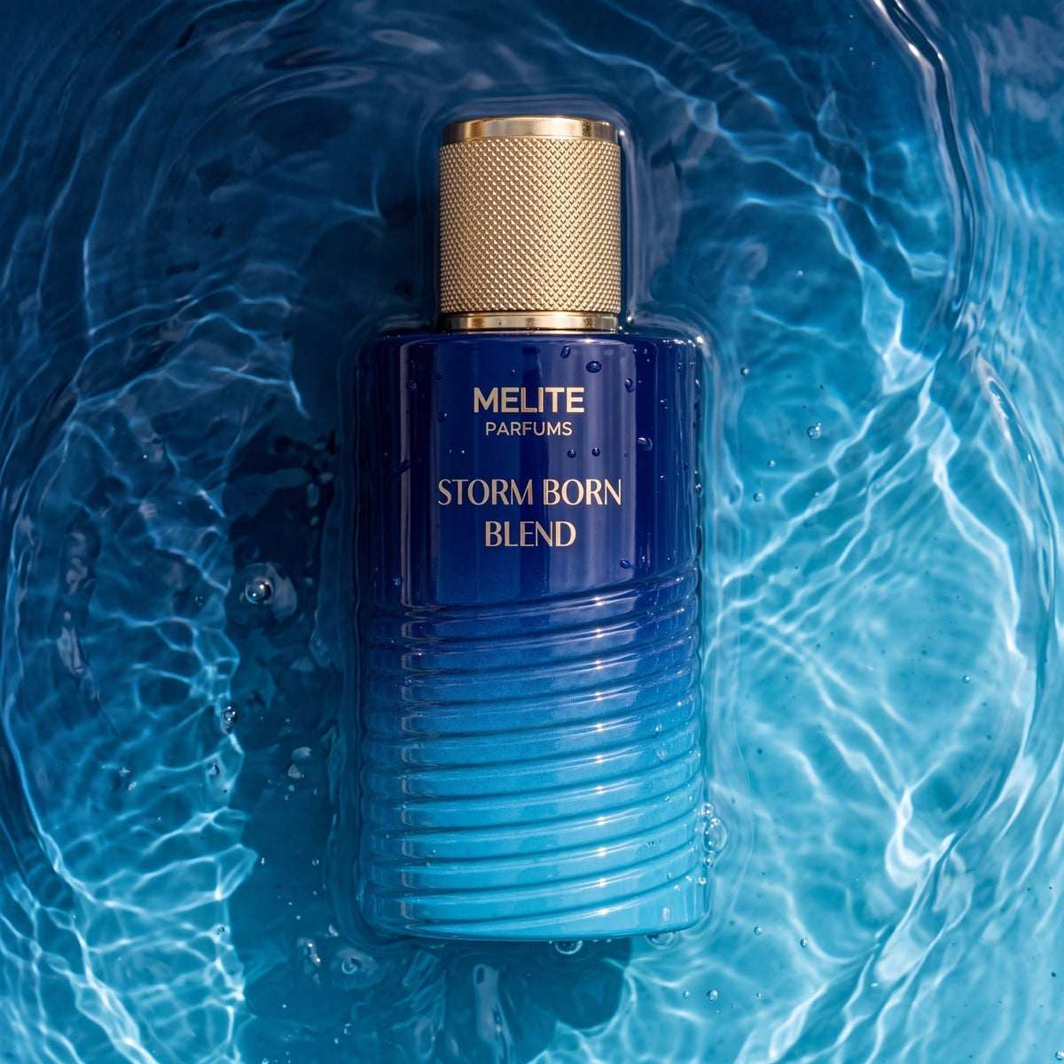 MELITE PARFUMS Storm Born Blend men's EDP in a blue ombre glass bottle with a gold cap, submerged in rippling water.