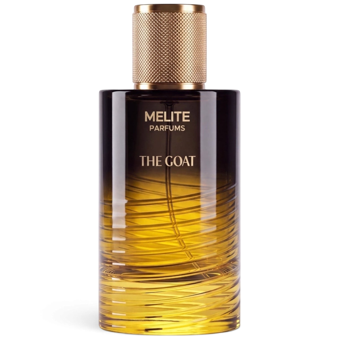 MELITE PARFUMS The Goat unisex eau de parfum in a glass bottle with a gold textured cap and amber gradient design.