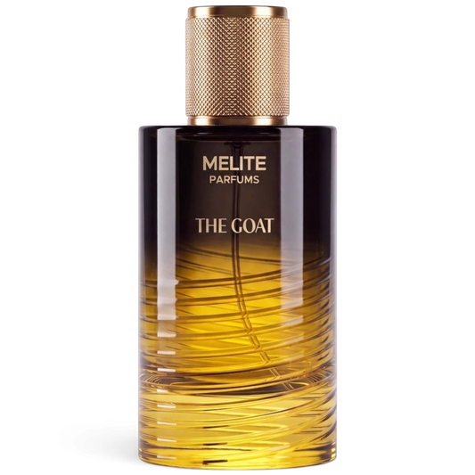 MELITE PARFUMS The Goat unisex eau de parfum in a glass bottle with a gold textured cap and amber gradient design.