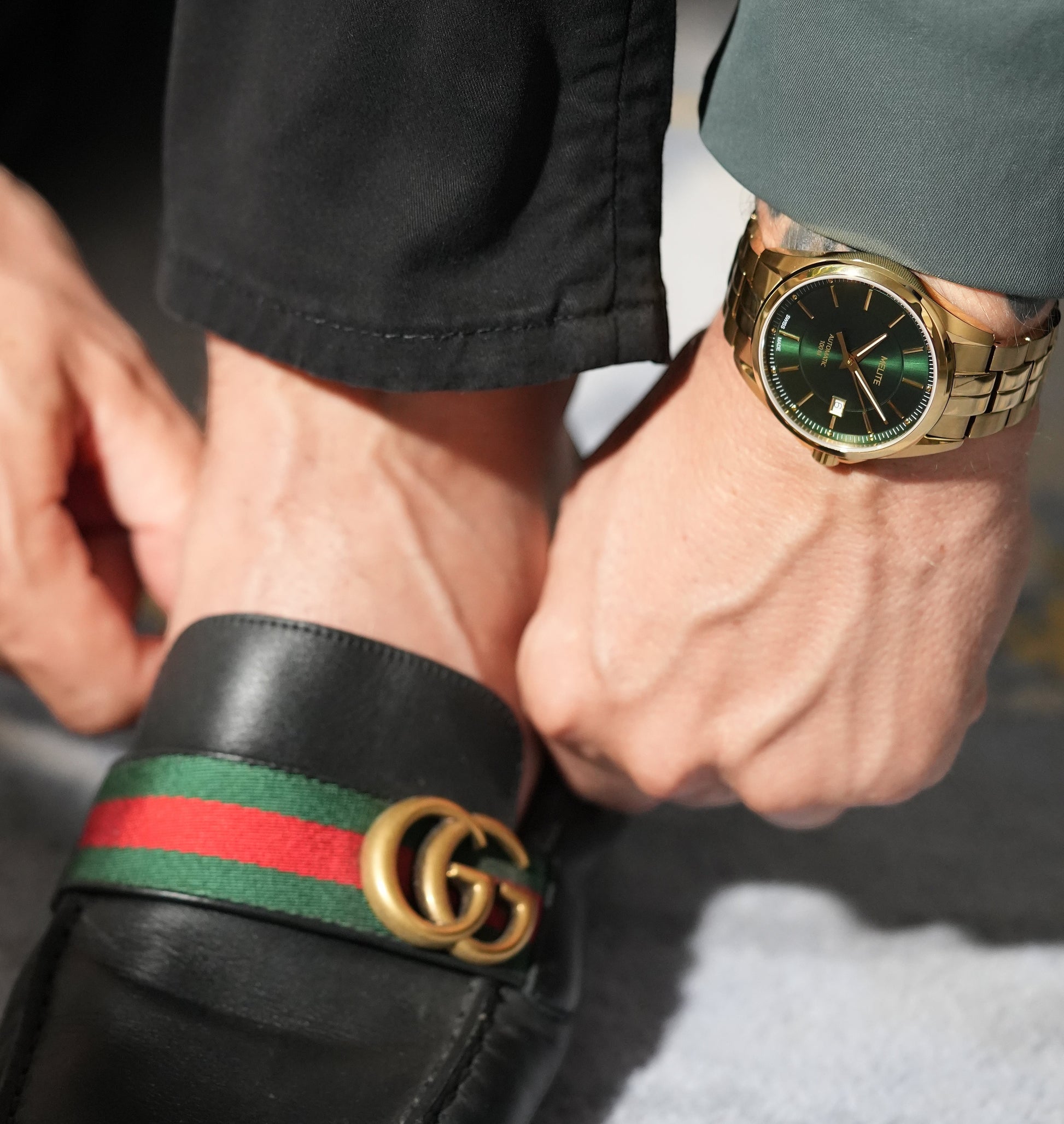 MELITE PARFUMSH Men's gold PVD stainless steel watch with emerald green sunburst dial and gold markers.