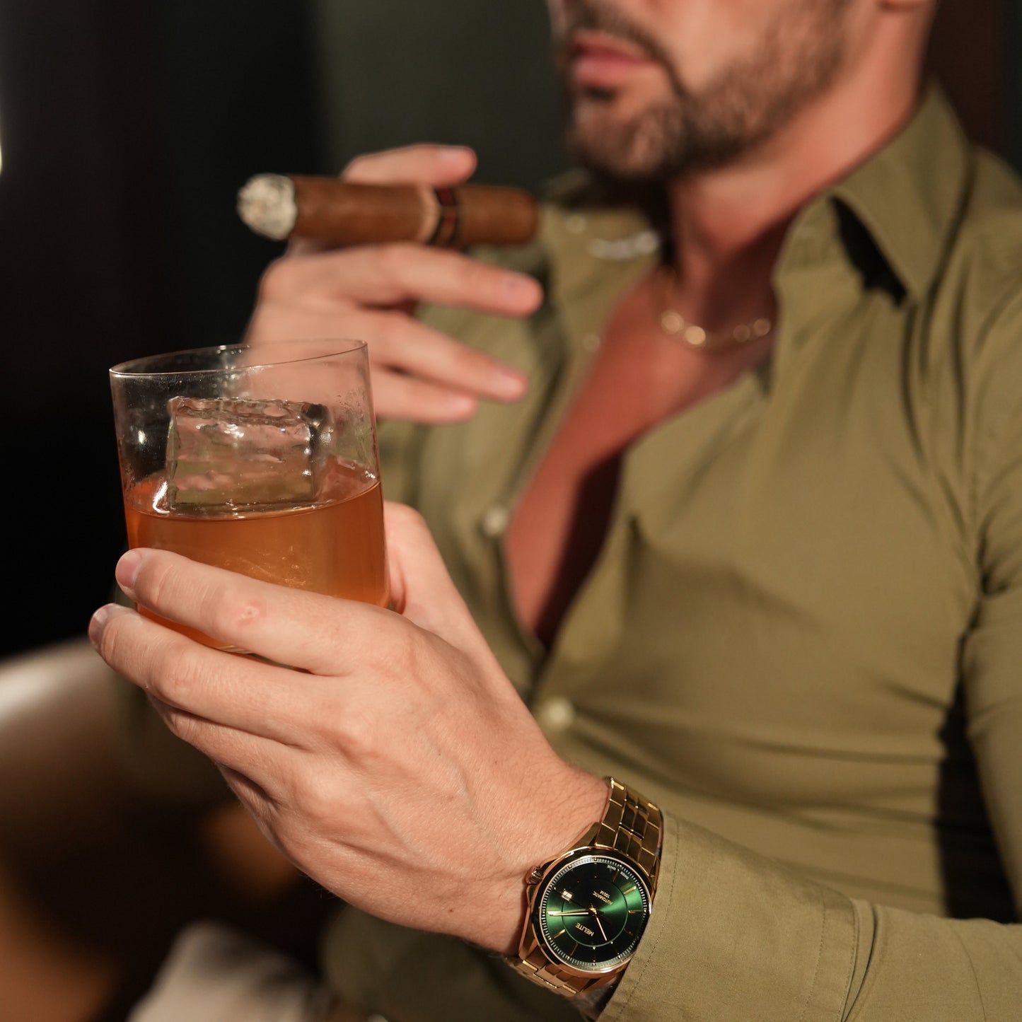 MELITE PARFUMSH Melite Money Talks Automatic watch with emerald green sunburst dial and gold PVD plated stainless steel bracelet.